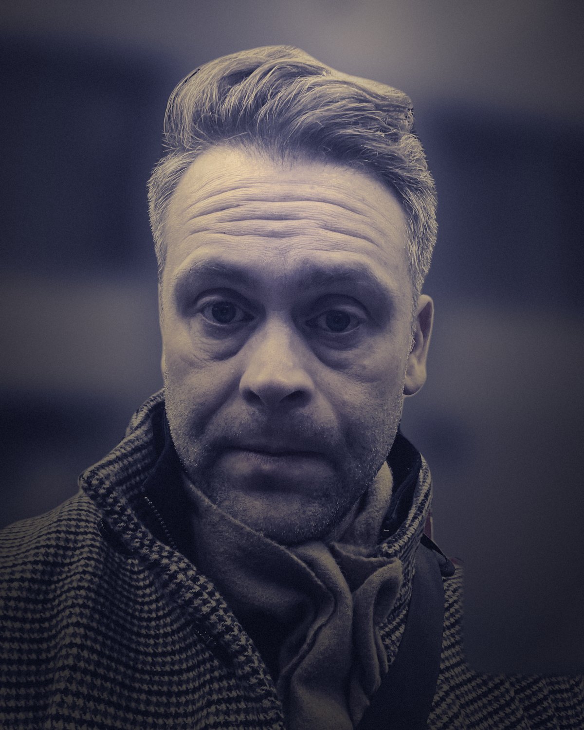 E.A. Marsh at a train station in a wool coat and scarf